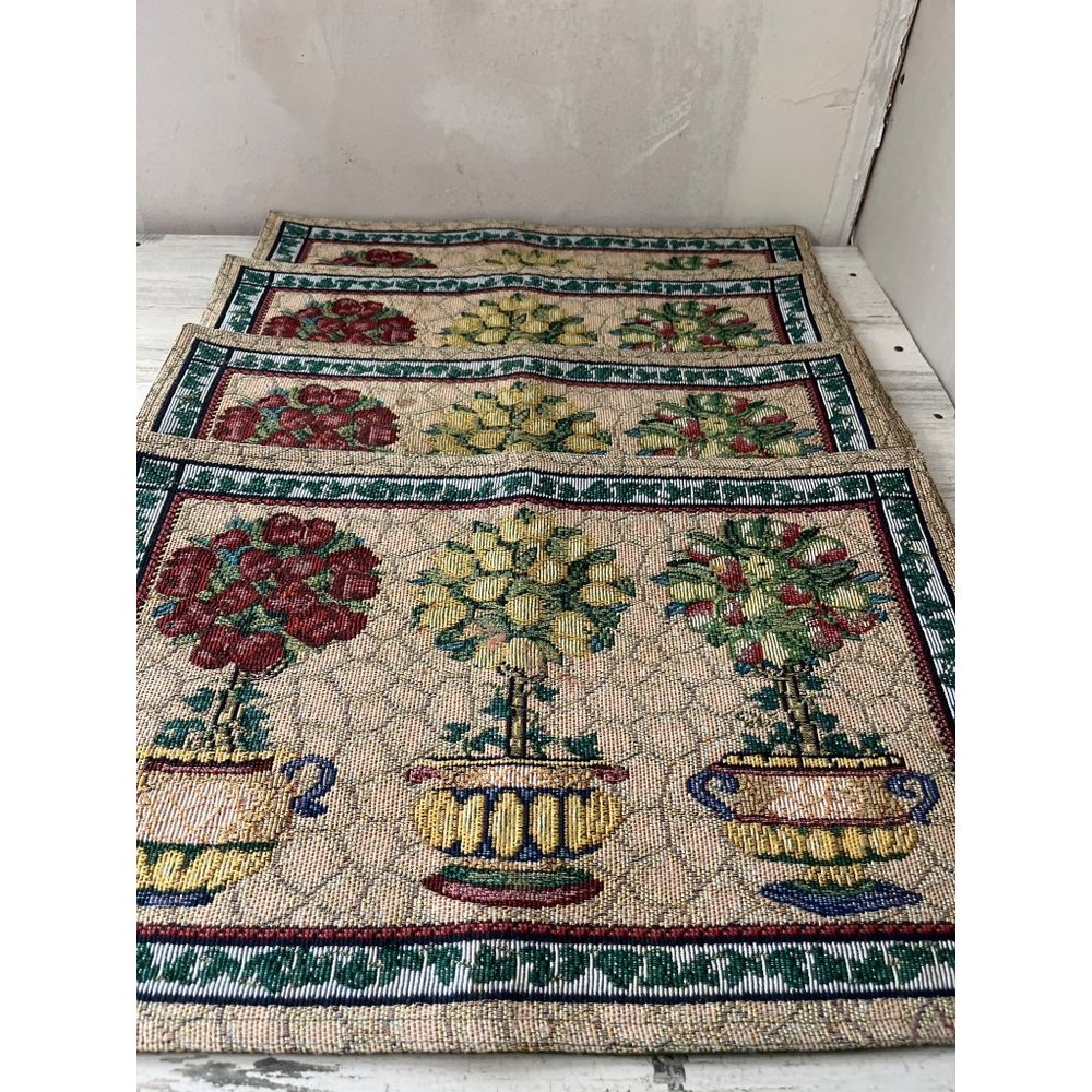 Set of eight cloth placemats with topiary designs